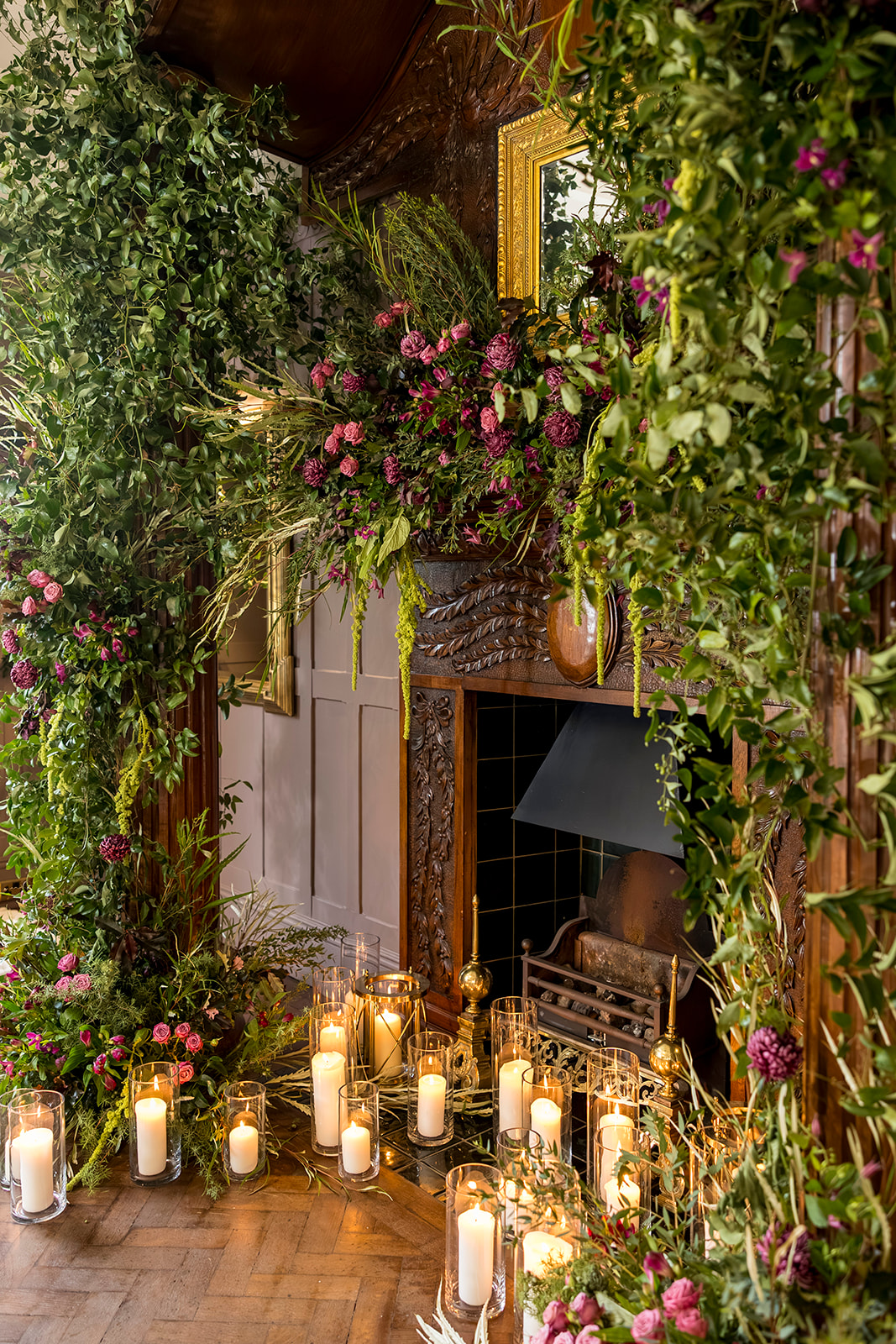 Flower framed fireplace and candlelit styling at Ellingham Hall