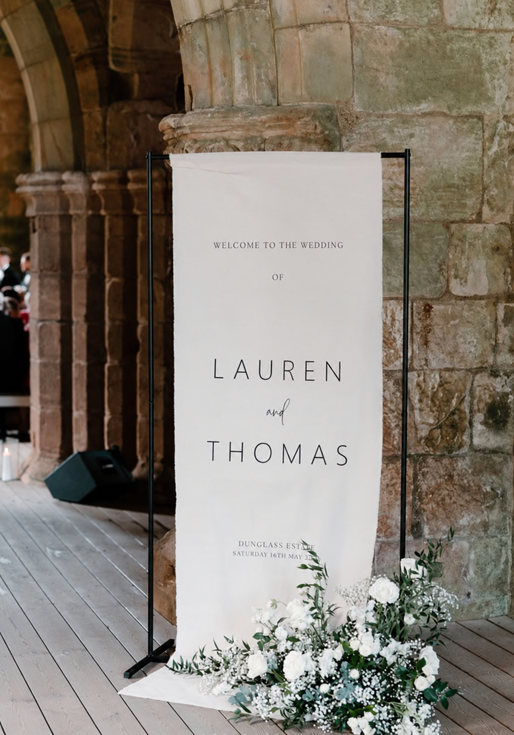 Personalised wedding welcome sign with white flowers at Dunglass Estate