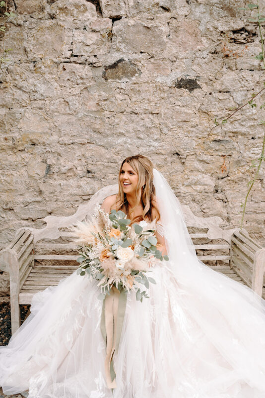 Bride carrying a bespoke wedding bouquet